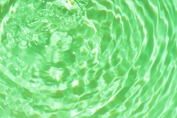 istock Waves on the beach. Blue sea wave. Blue water surface texture with ripples, splashes, and bubbles. Abstract summer banner background Water waves in sunlight with copy space cosmetic moisturizer. 2029155796