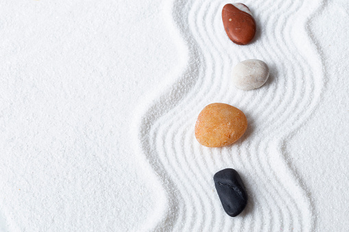 Zen garden with the white sand and stones