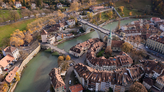 aerial view the Kirchenfeld bridge above the Aare river in Bern with the gothic famous cathedral, in Switzerland capital city,Stunning beautifuel drone footage of Bern the capital of Switzerland