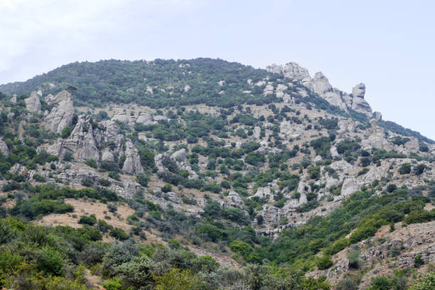 istock A scenic view of a rugged mountain landscape under a dramatic cloudy sky. 2029293383