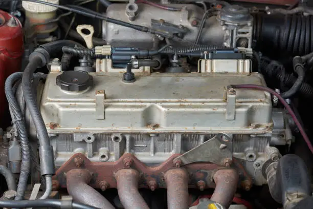 Photo of close-up of old and used car engine or motor