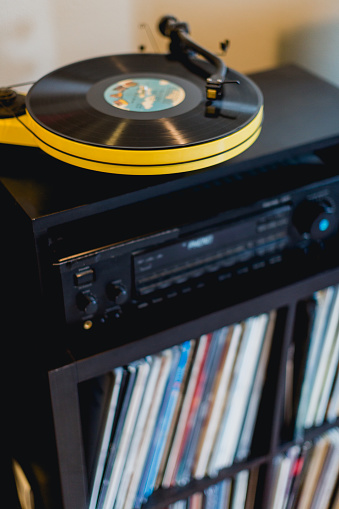 Stay at home and listen to vinyl records and play your favorite music on the record player.
