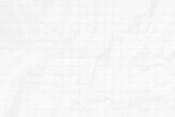 Vector illustration of White coloured creased crumpled crushed rough paper horizontal vector backgrounds with wrinkles and creases and faint gray colored checkered pattern or checks like a blank empty faded page of math notepad