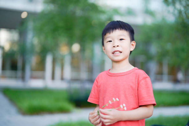 Boy with Dandelion in the Park