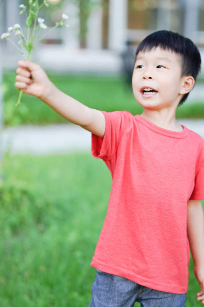 Boy with Dandelion in the Park