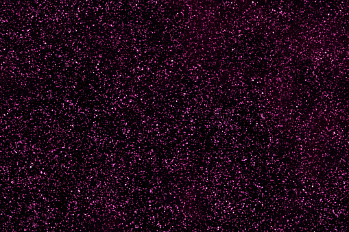 Purple glitter star galaxy background. Stars in space. Night sky with stars. Sparkle shiny light magenta violet pink backdrop. Starry night sky. New Year and Christmas and Celebration backgrounds.