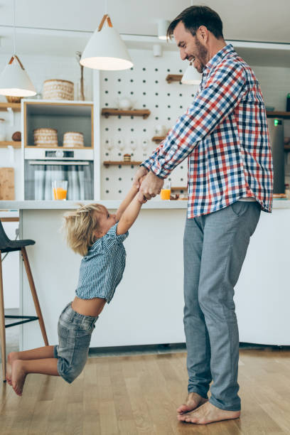 istock Happy young dad playing with his son. 2029410839