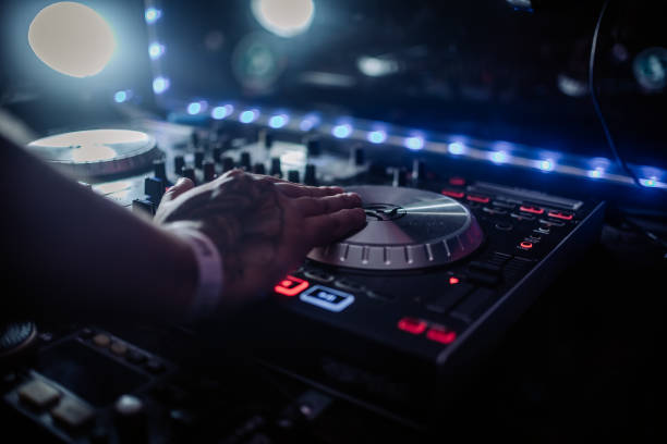 istock Music Background DJ Night Club Deejay Record Player Blurred Crowd Dancing 2029433204