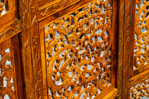 Close up front view of traditional Moroccan wooden door texture background in Fez, Morocco, North Africa.