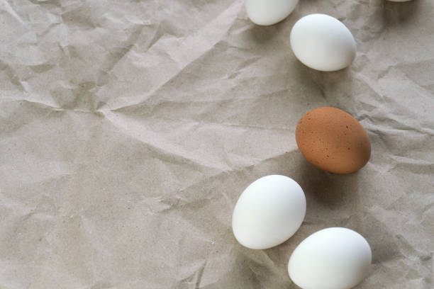 istock White and brown eggs on the table. View from above 2029467334