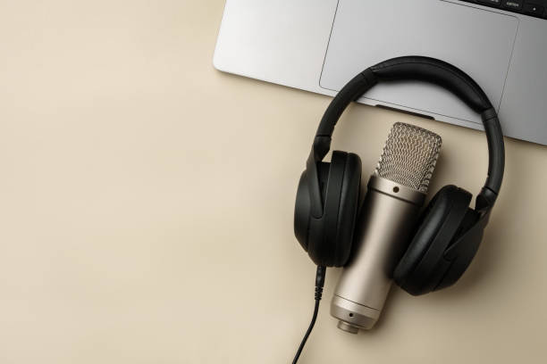 istock Headphones and microphone on the table close up 2029481647