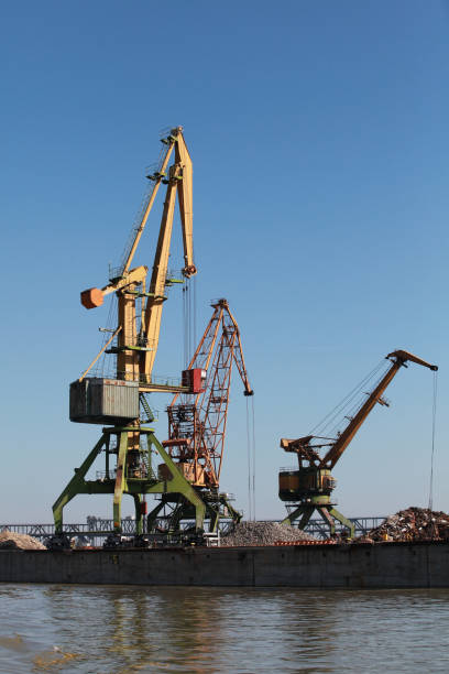 istock Port cranes stand on a quay in harbor 2029484316
