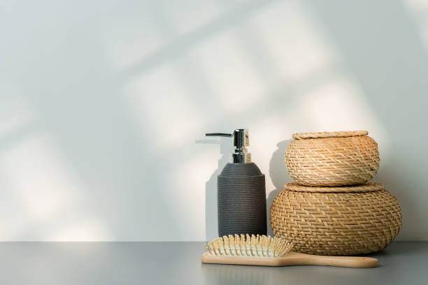 istock Soap dispenser and hair brush on gray background 2029507375