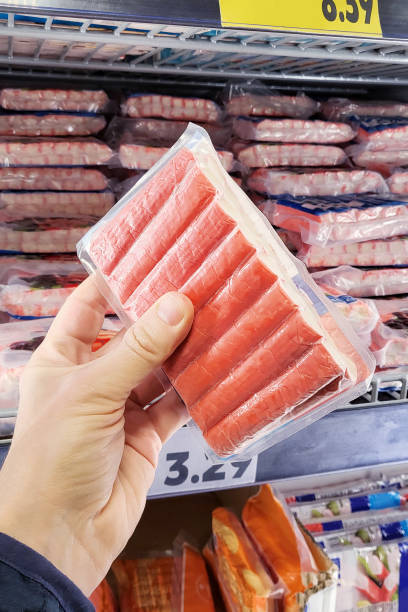 istock Crab stick surimi in the buyer hand 2029508904