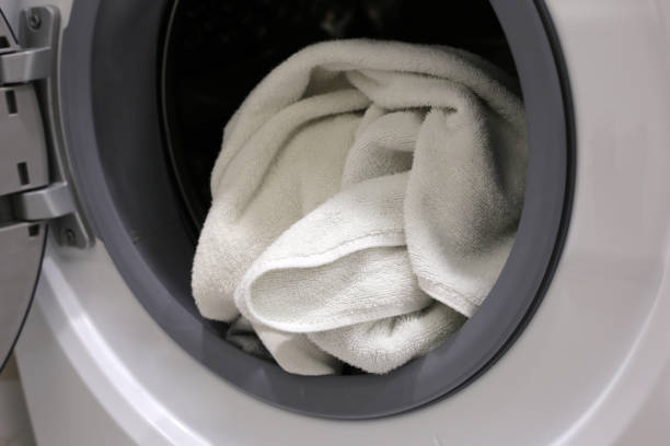 istock Used towel in washing machine 2029518372
