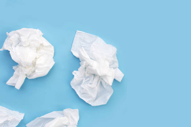 istock Crumpled tissue paper. Facial tissue on blue background. 2029568575