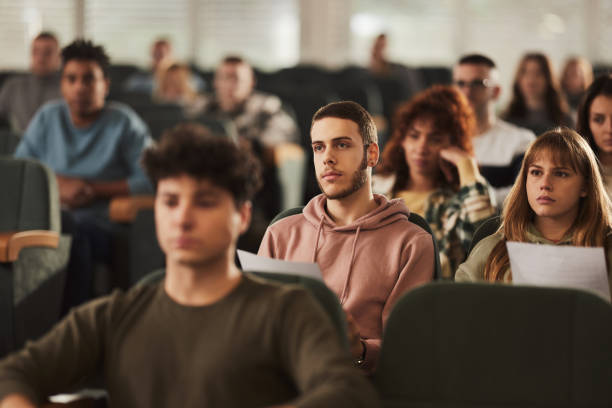 istock College students attending a class in amphitheater. 2029588867