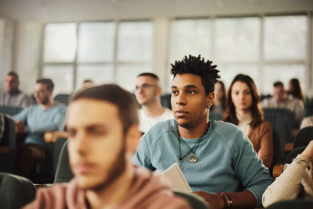 istock Concentrated black male student on a class in amphitheater. 2029589394