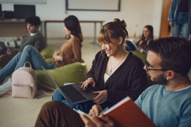 istock Couple of students e-learning at casual classroom. 2029589930