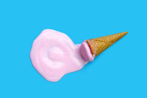 istock Melting ice cream with waffle cone on blue background. 2029597238