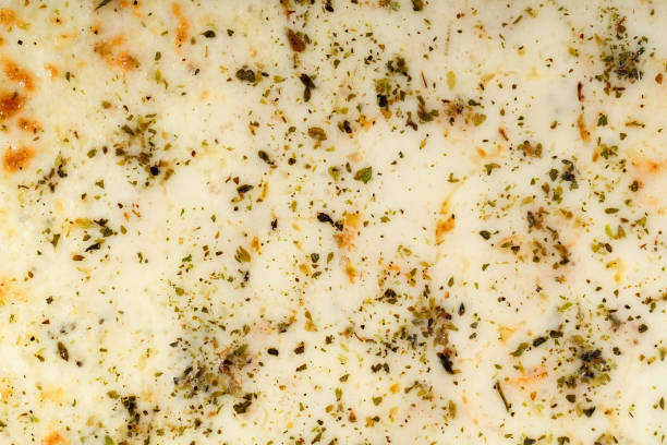 Texture of cheese and spices in baked pizza