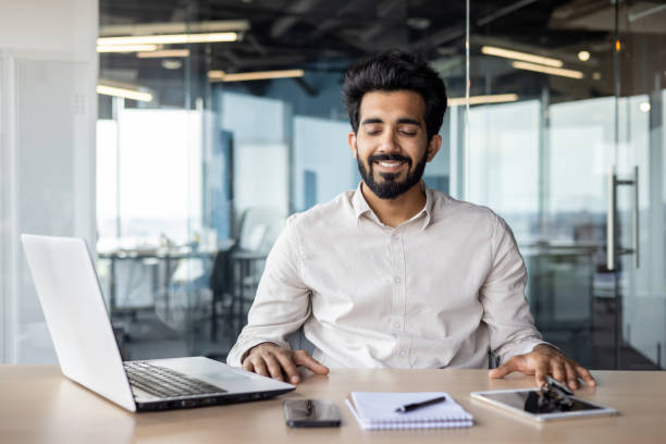 istock Confident indian businessman in office, working on laptop at modern desk 2029607121