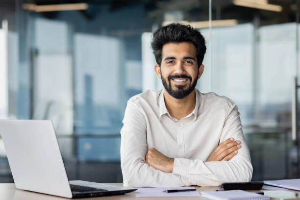 istock Confident indian businessman with beard working at office desk with laptop 2029607178