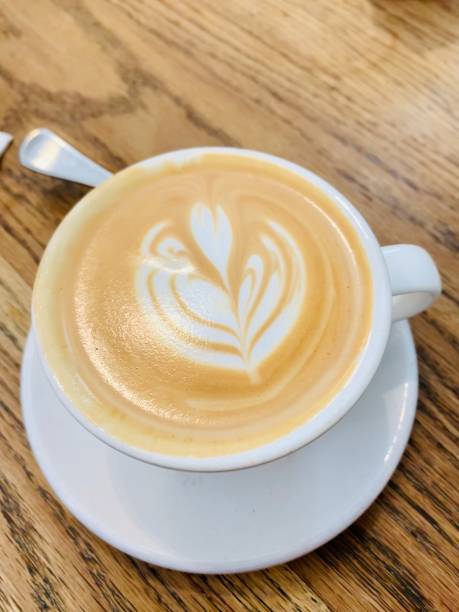 istock A cup of cappuccino placed on a wooden table 2029636564