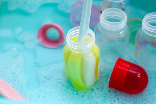 Scooping infant milk formula for bottle feeding