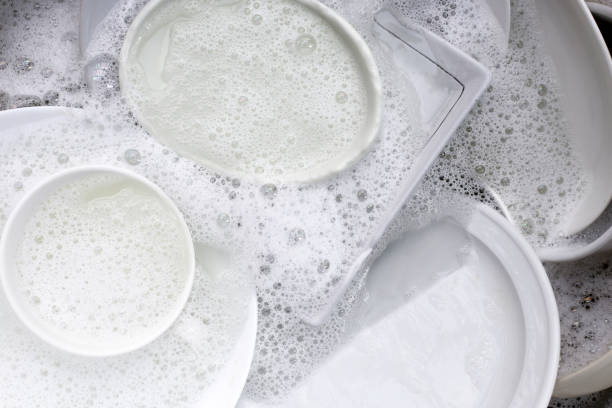 istock Dish washing, Dirty dishes soaking in kitchen sink. 2029645339