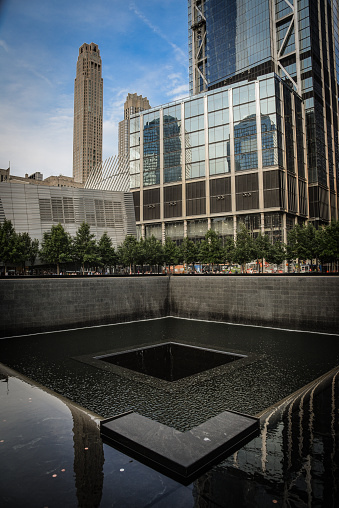 New York City, NY, USA - August 6, 2017:  View to the North Tower reflecting pool of the National September 11 Memorial  Museum in Manhattan