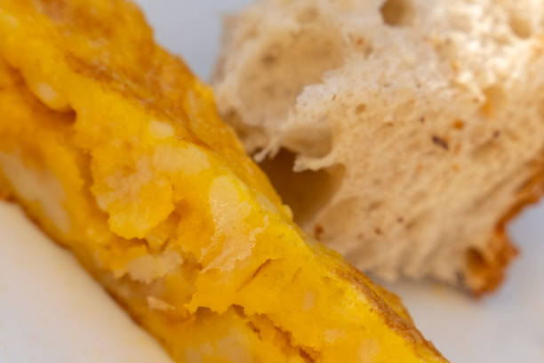 Spanish omelette with potatoes tapa on plate in bar terrace