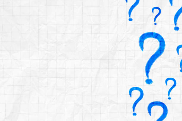 istock White creased crumpled crushed rough paper horizontal vector backgrounds with creases and faint gray colored checkered pattern empty weathered maths notebook page, one big Odd One standing out and several small blue question marks signs 2029674973