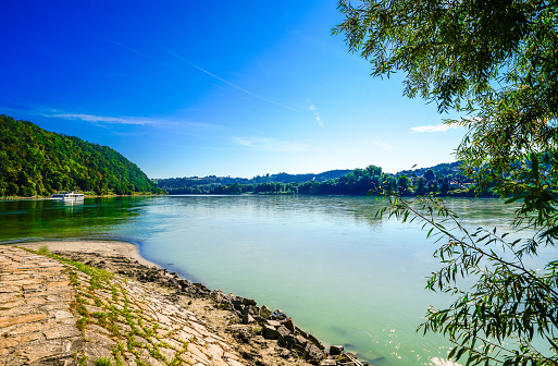 View of the confluence of the Inn and the Danube and the nature in Passau. Center of the city with the surrounding landscape at the intersection of three rivers.