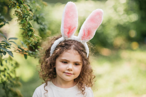 istock Baby with basket full of colorful eggs. Easter egg hunt. 2029707941