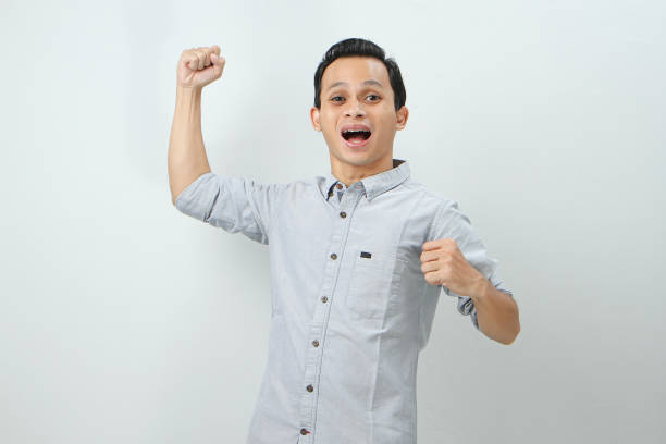istock happy confident asian indonesian man on isolated background 2029709015