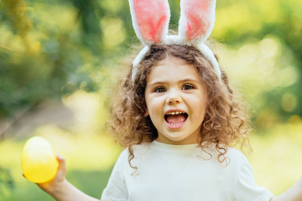 istock Baby with basket full of colorful eggs. Easter egg hunt. 2029709560