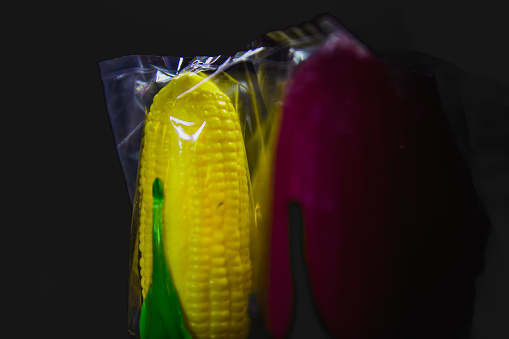 Yellow corn shaped candy made from sugar by blowing air inside.