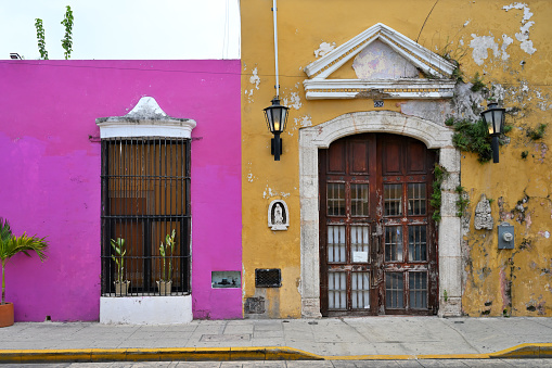 Colorful colonial style buildings at street of Merida city old town, Yucatan, Mexico