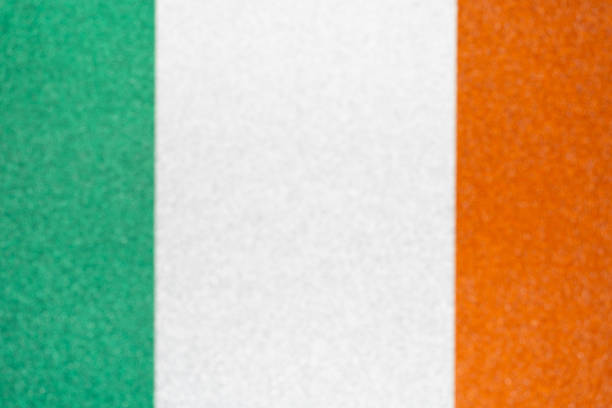 Irish flag made from color glitter paper. St Patrick's holiday background for greeting cards or banner templates