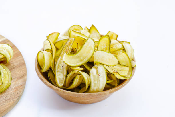istock Banana chips, fried slices banana with green peel 2029779289