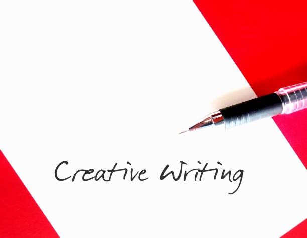istock On red background - pen writing on notebook CREATIVE WRITING, means writing with imaginative approach to subject matter - displays creative imagination or invention 2029779751