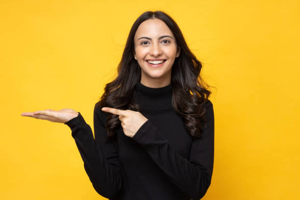 portrait of nice attractive girl copy space isolated bright yellow background stock photo - ciekawość zdjęcia i obrazy z banku zdjęć