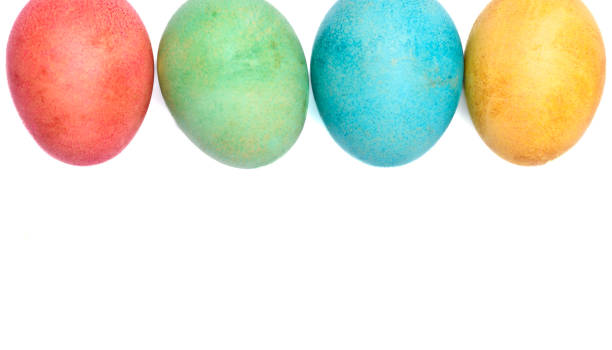 istock Colorful Easter eggs on a white background, along the top of the frame, space for text 2029794776