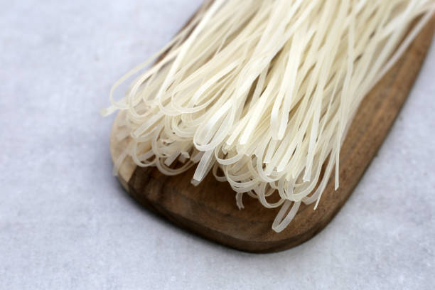istock Dried uncooked rice noodles. Raw rice flour noodles 2029797939
