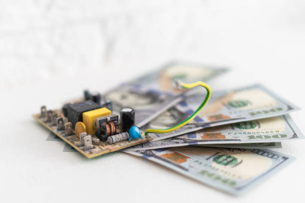 istock money and an electronic chip 2029799527