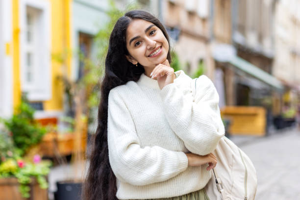 istock Joyful indian woman exploring city streets, sightseeing tourist experience 2029807408