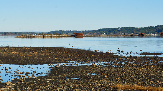 View of the Royston wrecks, old rusty navy hulls that once formed a breakwater.