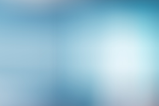 Abstract soft blue gradient background with smooth light lines for copy space.