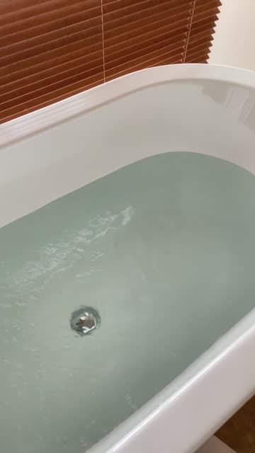 Close-up of water running into the bathtub